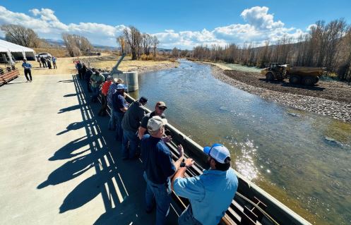 People talk by the Colorado Connectivity Channel. The Colorado Connectivity Channel is the largest aquatic habitat connectivity project in the State’s history and reconnected the Colorado and Fraser rivers by bypassing the Windy Gap Reservoir allowing for fish and sediment passage. This solution will provide water to growing communities, and minimize the environmental impact of the dam.